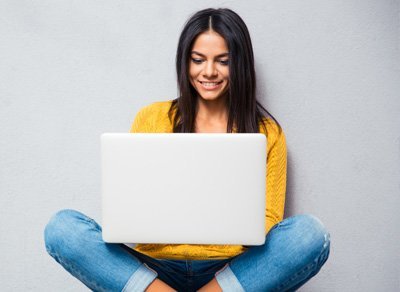 Woman typing on a laptop